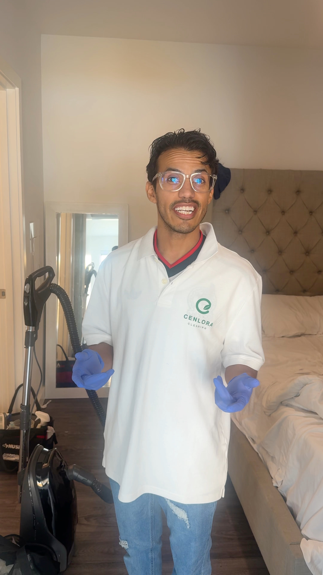 Smiling Cenlora cleaner in branded uniform with cleaning equipment