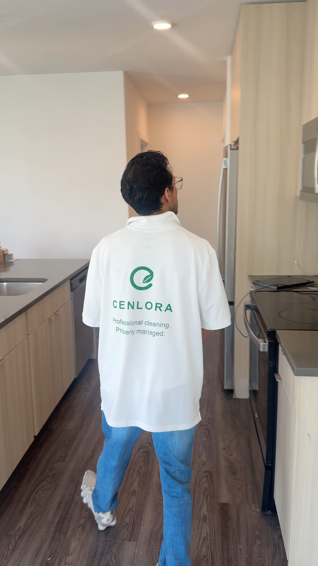 Cenlora logo on the back of a cleaner's uniform